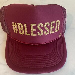 Mother trucker hat with the word blessed in gold shimmer. New with tags.